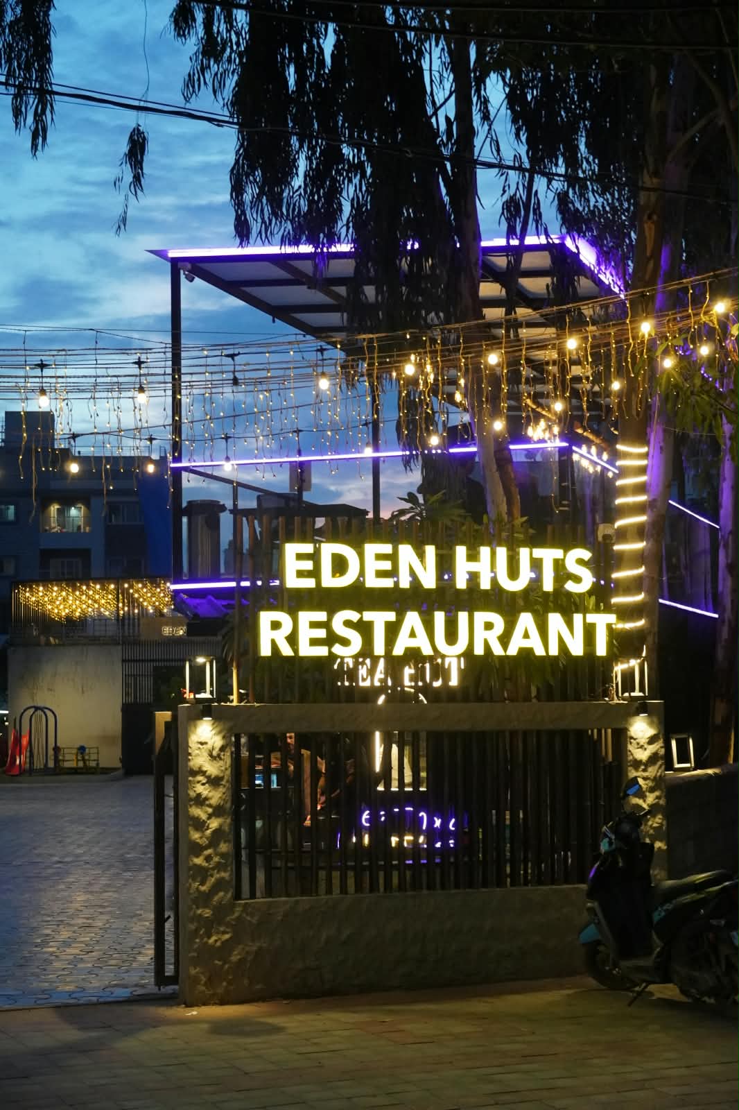Eden Huts Grand Entrance at Twilight
