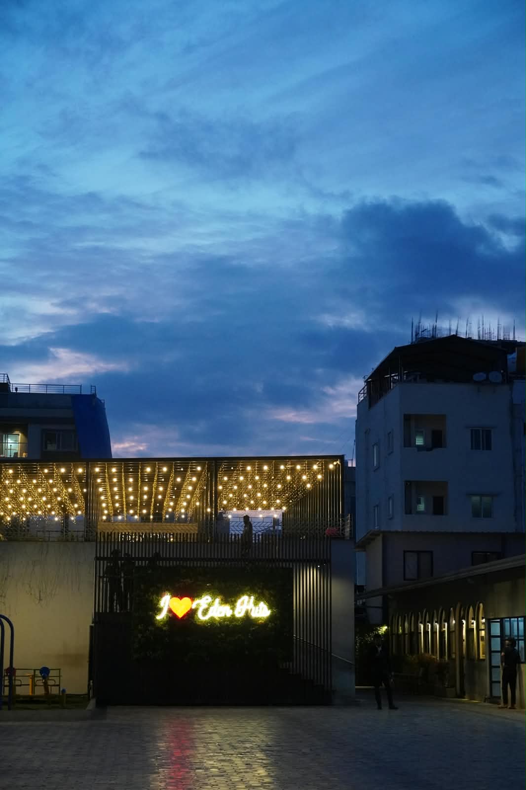 Starlight Rooftop Deck Beneath Cascading Fairy Lights